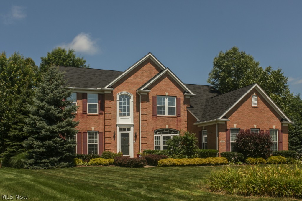 60K Price Reduction!!  Stunning 4 bedroom colonial former model that features almost 5000 square feet of living area.  The gourmet kitchen features 42" upgraded glass maple premium cabinetry, brand new granite counter tops, brand new stainless steel appliances including double ovens, new lighting, and a giant center island.  You will love the sun filled morning room right off the kitchen that boasts a vaulted ceiling and a view of the park like backyard.  Acres of solid maple hardwood floors flow through the first floor.A 22' by 19' family room is also open to the kitchen and features a stone surround fireplace and 9' ceilings.  The formal living room and dining room greet you with elegant bay windows, custom draperies, chair rail, and a tray ceiling.
The dramatic two story entry foyer and grand staircase lead you to the luxurious master suite with recessed tray ceiling, gorgeous double sink glamour bath, a sitting area, and his & hers walk-in closets. 3 additional bedrooms adjoin the