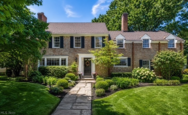 Welcome to this charming all-brick Colonial located in the highly desirable Poets’ Corner neighborhood of Shaker Heights. This prime location offers convenient access to John Carroll University, Fairmount Circle, Legacy Village, Beachwood Place, and several of Greater Cleveland’s premier private schools, including Gesu, University School, Laurel School, and Hathaway Brown School.

Offering over 2,000 square feet of living space, this home is loaded with timeless charm, character, and architectural detail. Step inside to find beautiful white oak hardwood floors throughout most of the home, a spacious living room highlighted by a classic gas fireplace, and a formal dining room perfect for entertaining. The bright and inviting sunroom features skylights and a sliding glass door that opens to a private paver patio, while the adjacent den is surrounded by walls of windows, creating an abundance of natural light.

Upstairs you’ll find three generously sized bedrooms, all with hardwood flooring, along with two full bathrooms. The primary suite includes its own private bath, and both bathrooms showcase stunning original Art Deco tile in exceptional condition.

A tremendous bonus room above the garage offers incredible flexibility and includes closet space, making it ideal as a fourth bedroom, family room, home office, or recreation area. This unique space also features beautiful wood-paneled walls, adding warmth, character, and timeless appeal.

Outside, enjoy the private backyard oasis featuring lush perennial gardens, mature landscaping, and plenty of room to relax or entertain. The backyard also includes a garden shed for additional storage and gardening needs. An oversized two-car garage provides even more storage and convenience.

Major updates include a newer roof, furnace, and hot water tank. A rare opportunity to own a character-filled home in one of Shaker Heights’ most sought-after neighborhoods.