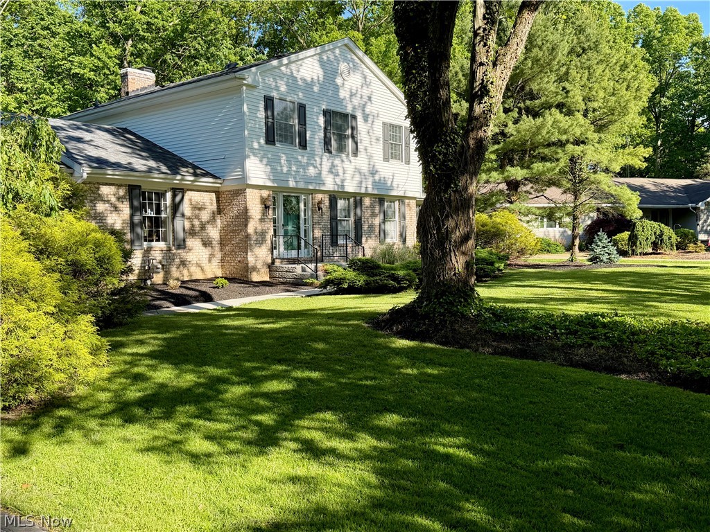 Absolutely phenomenal 4-bedroom, 2.5-bath home in the highly desirable Canfield School District! This spacious home features a large living room, formal dining room, and a cozy family room with a fireplace and access to the back deck overlooking a private backyard retreat. The eat-in kitchen offers upgraded countertops, stainless steel appliances, and a bright breakfast area. A huge first-floor primary suite includes a walk-in closet and private bath, while a convenient first-floor laundry room and half bath complete the main level. Upstairs, you'll find three additional generously sized bedrooms and a second full bath, providing plenty of space for family and guests. 
Beautiful landscaping immediately lends this home majestic curb appeal. Right as you step across its slate-tiled foyer you will be impressed by its uniformly spacious rooms. The house features a neutral color palette, refined window treatments in the living and dining rooms and gleaming hardwood floors in its four roomy bedrooms. The family room showcases a gas fireplace with a lodge-style hearth, and the recently refreshed kitchen features stainless steel appliances. Standing anywhere inside, your focus will be drawn to the ever-changing leafy pageant visible from the windows. Celebrated Canfield schools are right nearby, with the Campbell Elementary school just a block away and the Canfield High School less than a mile’s easy bike ride. Join the Canfield Swim and Tennis club, and when school is out, the whole family can greet neighbors for summer fun just by walking to the end of the tree-lined street. When serenity at home is preferred, step out onto the tiered backyard deck and soak in the warm spa, nestled within the complete privacy of a wooded yard. Appealing as it is right from the moment you turn up the driveway, this home’s stunning backyard oasis completes the picture and is matched by few at its price. It has been a cherished home; make it yours!
See Brokers Remarks for Recent Updates.