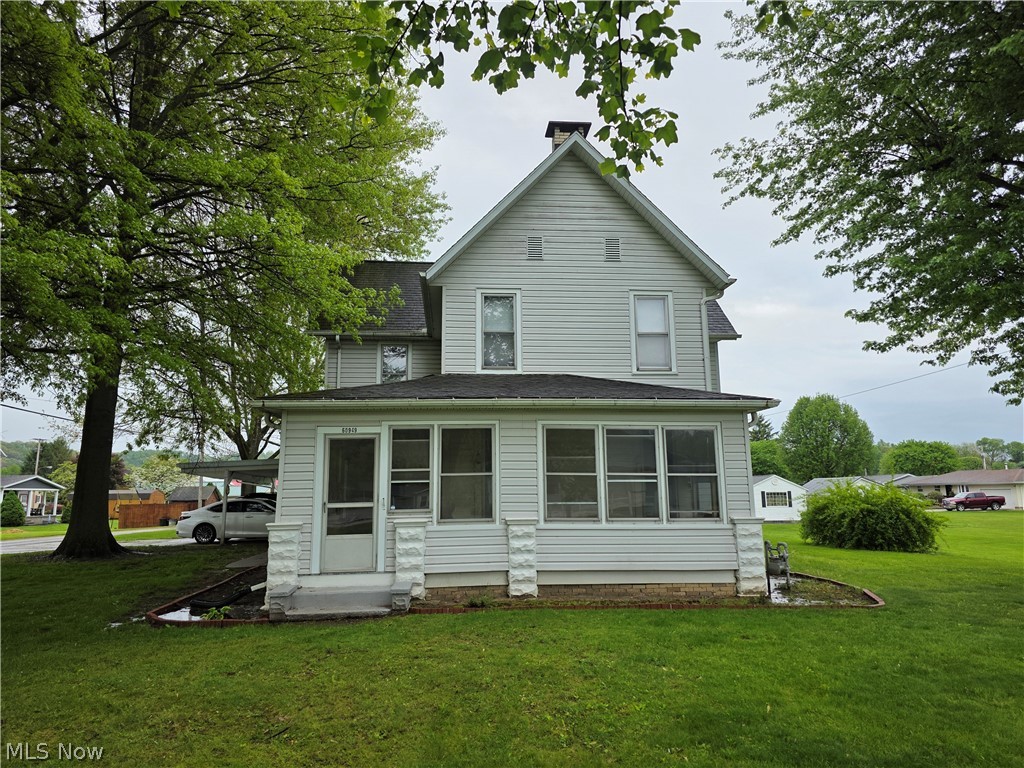 This is your opportunity to own a beautiful century home.  It features a large level lot with attached carport, shed, and beautiful shade trees.  The home is just outside city limits in Coshocton County. There is ample storage throughout, a first floor bedroom, bathroom, and laundry.  It has a formal dining room, living room, and massive kitchen.  The 2nd floor features three large bedrooms and a 2nd full bath.  Much of the original woodwork remains.  The house has had many updates including windows on the west side, some plumbing, and electric.  The kitchen has updated cabinets with pull outs for easy access.  Give it your personal touch and it could be your dream home.