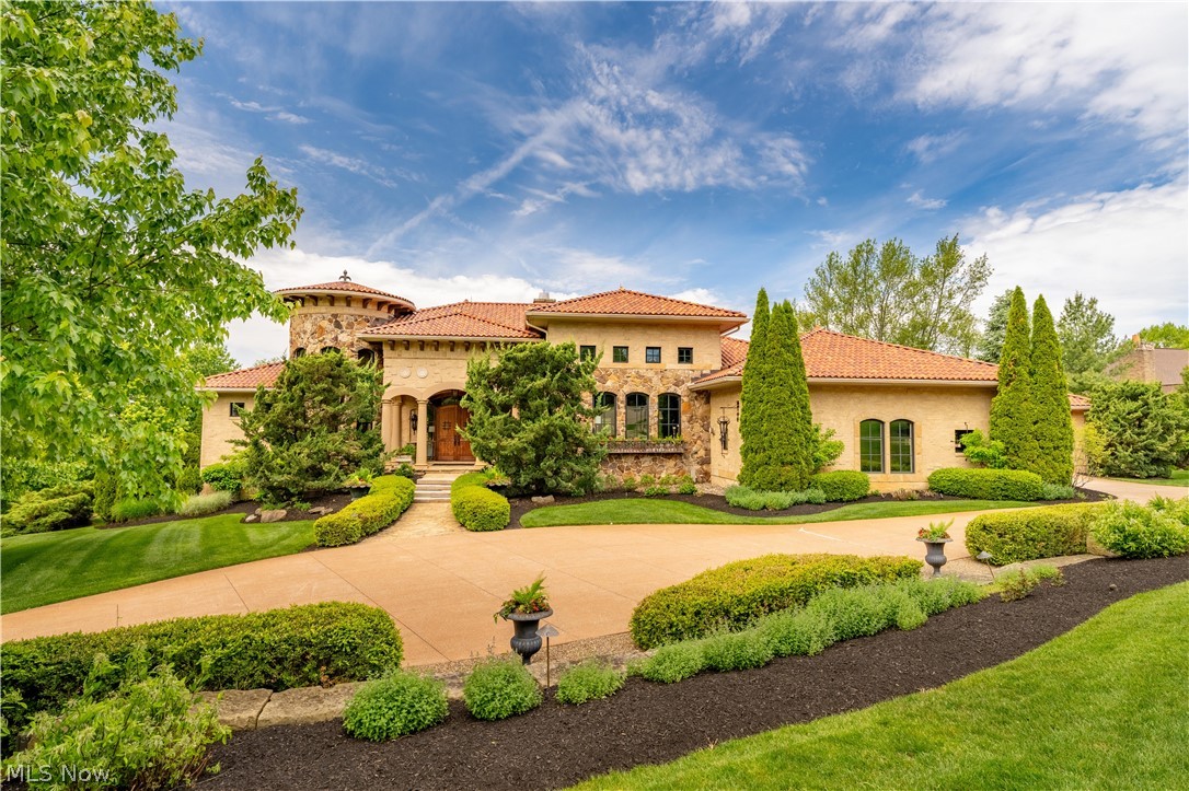 A true one-of-a-kind masterpiece, this custom-built estate offers over 8,000 square feet of thoughtfully designed living space, blending luxury, comfort, and exceptional craftsmanship throughout.
This remarkable home features four spacious ensuite bedrooms, each offering privacy and elegance. The owners suite is a private retreat, complete with its own fireplace, a generously sized spa-like bath, walk-in closet, and dedicated laundry for ultimate convenience.
At the heart of the home, the chefs kitchen is designed to impress, showcasing a premium Wolf range, Miele coffee station, and high-end finishes that make both everyday living and entertaining effortless. Four fireplaces throughout the home create warm, inviting spaces in every season.
The walk-out lower level is an entertainers dream, featuring an indoor pool, grotto-style area, and expansive spaces perfect for gatherings or relaxation.
Step outside to discover beautifully designed outdoor living areas, including a covered patio with a fireplace, ideal for year-round enjoyment. The home is perfectly situated on 1.58 acres of meticulously manicured grounds, offering both privacy and scenic beauty.
Additional highlights include a heated 4-car garage, central Vac-U-Flo system, and countless custom details throughout.
This extraordinary property must be experienced to be fully appreciated.  Ask for the complete list of features and upgrades this exceptional home has to offer.