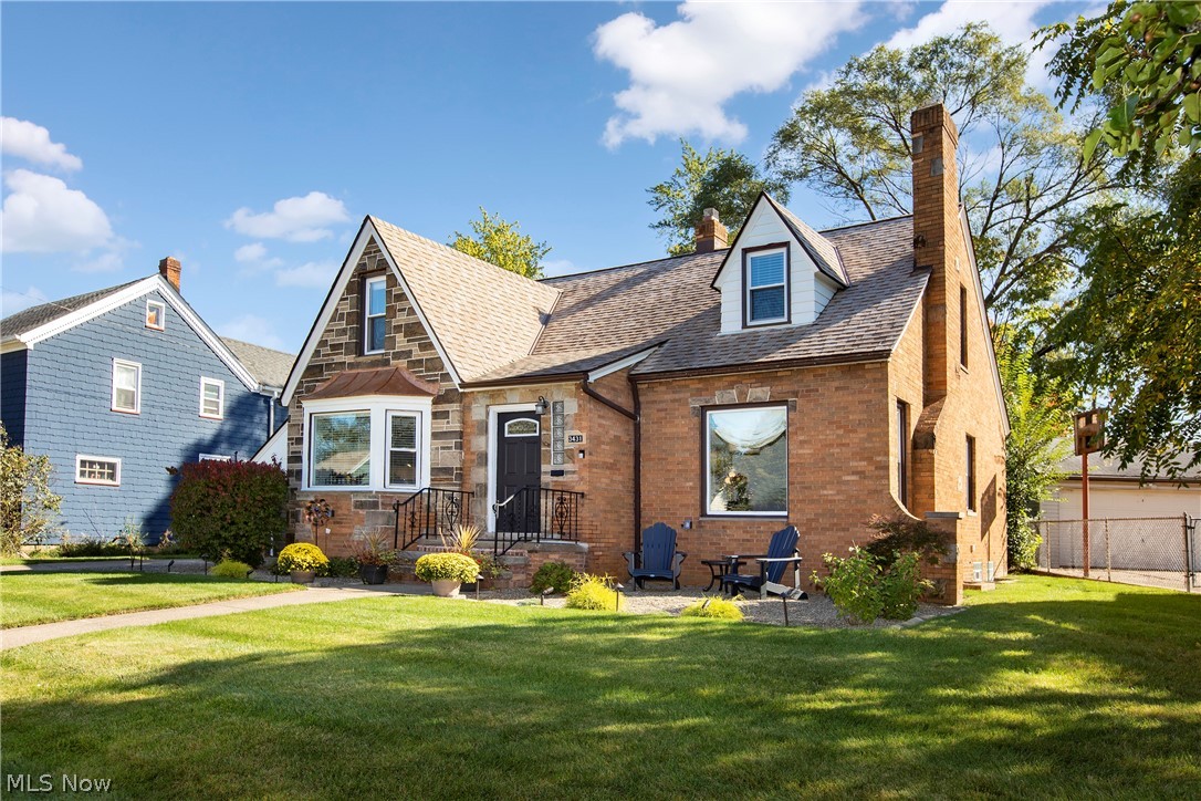 Honey, STOP THE CAR!! This charming brick & stone home has it all. Located on a sweet red brick road...enjoy a true West Park neighborhood to walk your pup, watch kiddos play & meet friendly folks! Eat-in kitchen offers granite, breakfast bar, stainless appliances & updated kitchen cabinetry! Wall was opened into the Living room for prime entertaining space. Stunning 1st floor bathroom is all class! Double sinks with quartz, ginormous walk-in shower includes stunning, high-end brass fixtures! Sleeping options include master upstairs or downstairs!  Additional 1st floor bedroom is functioning as a walk-in closet (can be easily converted back). Two full baths plus an additional 3/4 bath in the LL. You will enjoy the Rec room for Browns games/entertaining plus easy work-from-home space.   Bonus room on 2nd floor can be used as office/nursery/reading room.  All appliances included. Enjoy morning coffee or an evening cocktail in the sunroom overlooking the fenced yard! Close to Warren Villa