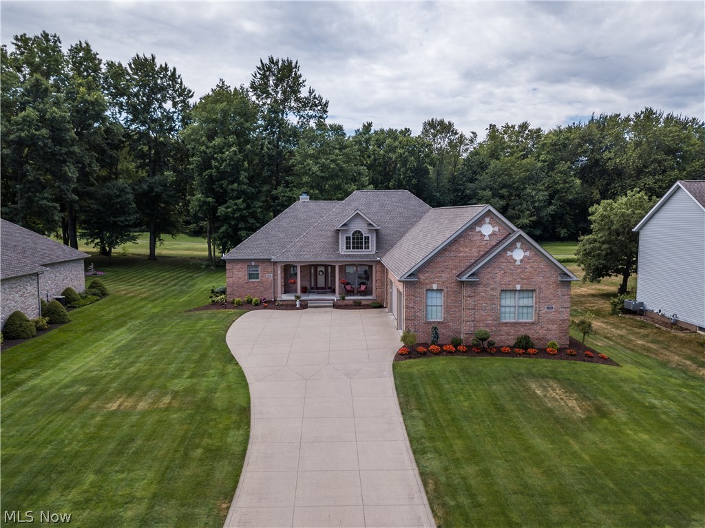 Beautiful custom ranch home, built in 2004, located in Chenoweth Country Club Estates. This home Features 4 beds and 3 1/2 baths. The open floor plan with cathedral ceilings, has gorgeous Brazilian cherry hardwood floors throughout most of the first floor.  The focal point in the great room is a stone, gas log fireplace, with floor to ceiling windows overlooking Chenoweth Golf course that floods the room with natural light. The kitchen features cherry cabinets, Corian countertops, newer Kitchen Aid stainless steel appliances, built in oven, and a breakfast nook with bayed windows. From the kitchen you can walk out to a covered porch and patio that overlooks the 6th tee on the golf course. First floor has three bedrooms and 2 1/2 baths. The large master bedroom, with trayed ceilings and bayed out area, has two separate walk in closets. The master bath includes double sinks, Jacuzzi tub, and a large shower. The finished basement includes a living area, 4th bedroom/or den, full bathroom a