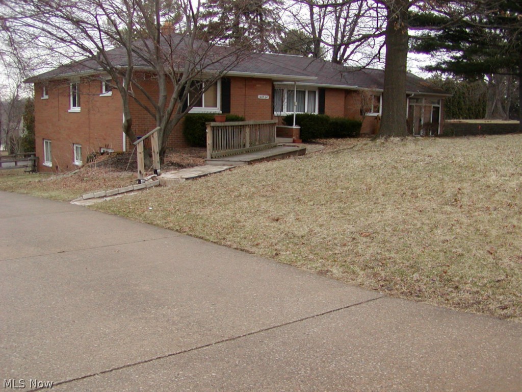 Lot 115 X 180.Don't miss this exceptional ranch with many extras to offer. 3 bedrooms on the main level plus a 4th bedroom in the walk-out basement level that boasts a full 2nd living area with a kitchen, living room & private bath for a mother-in-law or son or daughter who moves back in. Private entrance. A recreation area in the lower level next to the laundry room & another full shower bath.  On the main level is a full bath,  homemaker's dream  applianced kitchen with granite counters & many cupboards. From the kitchen relax in the rustic family room with woodburning stove then enter your  wonderful sun room with vaulted ceiling. Lots of storage. Square footage does not include the finished walk-out basement recreation room or the furnished mother-in-law area.