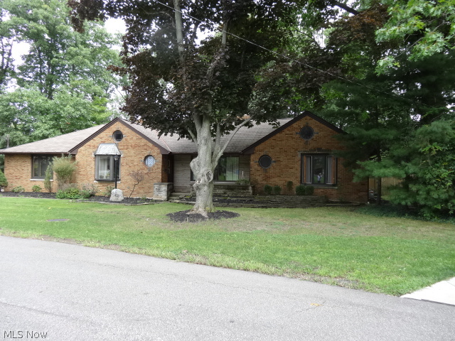 If you are looking for a beautiful back yard and a view that shows nature at its best, then this is the home for you. This 3 bedroom, 2 bath, all brick Ranch has that view. It sits on almost a 2 acre cul-de-sac wooded lot. Most of the windows are brand new. It has a newer roof and updated bathroom. The new kitchen comes with granite counter tops, and all Brand New Stainless Steel appliances. The eat in dinette has a wet bar that looks into the 26 x 25 Great Room with fire place and brand new Cherry floors. As you move outside from the Great room you will be on a covered patio and a multi-tier deck that has a screened gazebo and your private wooded lot. There a wine cellar in the crawl space. It comes with 2 furnaces & 2 air conditioners for zone heating and cooling. The hot tub and pool table are negotiable. This one is a Must see!
