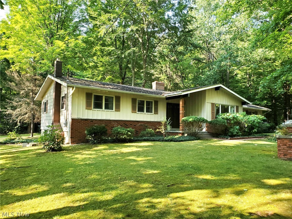 One of the prettiest lots in Northern Mantua is the setting for this 3 bedroom 1.5 bath ranch with full walkout basement, two car attached garage and an extra 24x24 storage building for boats, lawn equipment, atvs, etc. The house features a vaulted ceiling in the living room with a floor to ceiling double sided brick fireplace. Sliding glass door from dining room will lead you outside where you’ll find a large deck with outdoor fireplace, brick patio/walkways as well as a carport off the driveway. The yard features large trees, ivy, myrtle and hostas. Conveniently located west of SR44, not far from SR422.