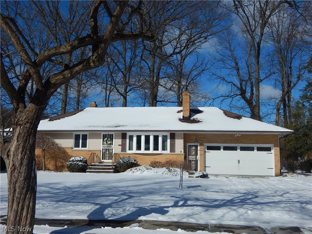 Handsome 3 bedoorm 1.5 Bath Brick/Vinyl Ranch enjoys privacy on a No Outlet Street. Set among winding roads and Mature trees. Freshly painted spacious Kitchen has Solid surface Corian tops, & sink, gorgeous all Wood Cabinetry, Refrigerator, Stove & Microwave stays.  1/2 bath in hall. Living Room features a gorgeous Bay window, Gas Stone Fireplace, & hardwood under carpeting. Spacious Formal Dining room has a wide, glass, built in buffet for all your treasures. 3 Nice sized bedrooms. Full bath has original, pristine tile. The 4 season, heated, Sunroom has 4 picture windows to take in gorgeous views of the yard. Door leads to cozy deck & onto a generous sized, circular, paver stone patio with piped Gas grill, all framed by extensive landscaping & custom fencing. New driveway 3 yrs, Furnace & AC 2021 Updated windows, New garage door & opener. Basement features a Rec Room with a brick, woodburning fireplace and lots of built in furniture. So great for that Man cave or space for the Kiddos!
