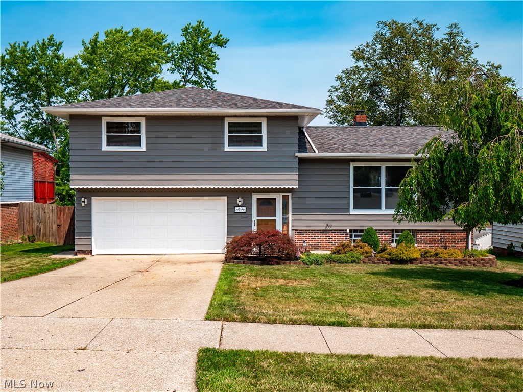 Bright, welcoming, and thoughtfully updated, this split-level home offers comfortable living in a convenient Parma location. Rich hardwood floors flow through the spacious living room, where natural light and an open layout create an inviting first impression. The dining area connects seamlessly to the updated kitchen (2025) featuring quartz countertops, refinished cabinetry, stylish backsplash, updated lighting, and direct access to the expansive deck overlooking the backyard.

The finished basement with fireplace provides additional living space, while the large deck offers plenty of room for outdoor dining, grilling, and entertaining. The fenced backyard provides space to relax, play, or gather around the fire pit.

Recent improvements include a newer roof (2024), freshly painted exterior (2024), updated full bathroom and fresh main-level paint (2026), water heater (2026), plus numerous interior updates throughout. Conveniently located near parks, shopping, dining, and highway access, this home blends everyday comfort with thoughtful updates inside and out.

PLEASE ALLOW 48 HOURS for response to any offers