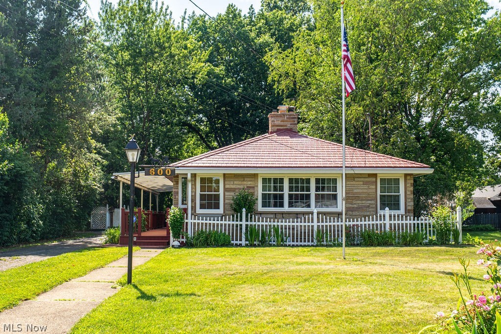 Looking for a solid Broyhill brick ranch? This unique home is tucked away in a quiet neighborhood and was built to
stand the test of time. The versatile floor plan offers multiple living options, with the main level featuring a spacious
living room, large kitchen, two bedrooms, a full bath, and 'a convenient breezeway. The finished lower level provides 
excellent potential for separate living quarters, complete with a bedroom, living room featuring a vintage bar, kitchen
area, full bath, and the possibility of a private entrance. Outside, you'll find a peaceful, shaded backyard with a storage shed, a massive side deck perfect perfect for entertaining, and an additional private deck for for relaxing. Low-maintenance living is enhanced by the all-brick exterior and lifetime metal roof. A rare opportunity with endless possibilities.