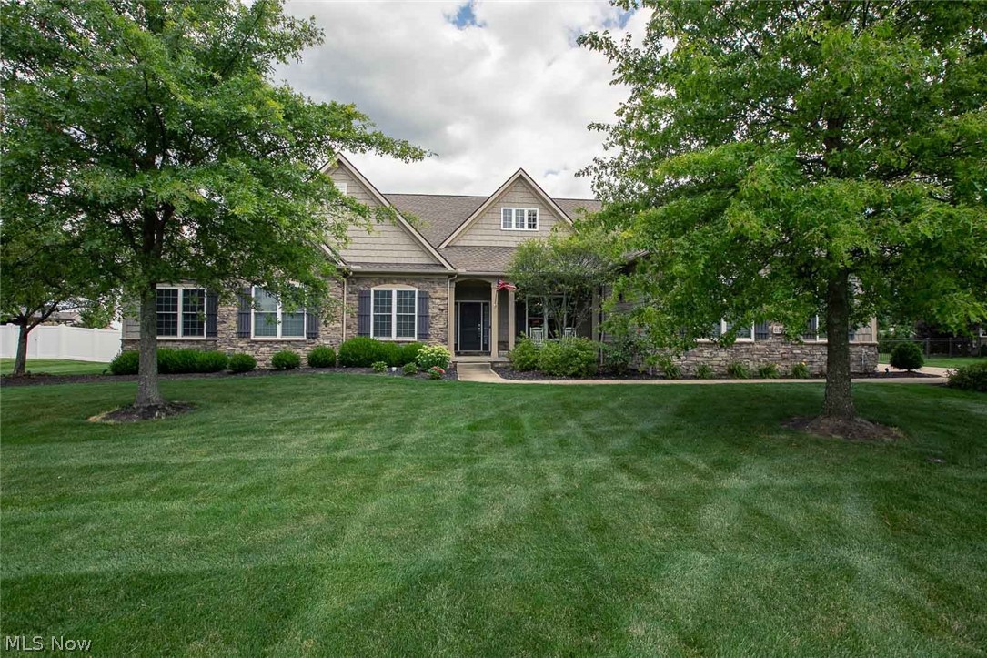 Introducing 6811 Deer Tail Dr, the custom built Ranch home that you have been looking for, located in the prestigious Whitetail Crossing subdivision.  The immediate impact of all the custom features is noticed in the foyer, which has a mosaic tile design within the engineered hardwood flooring.  You will also see the office/library and the dining room, which is accented with columns and extensive moldings.  The open floor plan leads you to the vaulted great room, which has a floor-to-ceiling stone gas fireplace.  Next you will view the morning room and remodeled kitchen with granite countertops, SS appliances. center island, breakfast bar, pantry, and even a pot filler and hot water dispenser.  The primary bedroom features an en-suite bathroom and a large California Closet designed walk-in closet.  Three additional bedrooms are found on the main floor.  The fully finished lower level offers a secondary living and entertainment area with a stone fireplace, full kitchen with all applianc