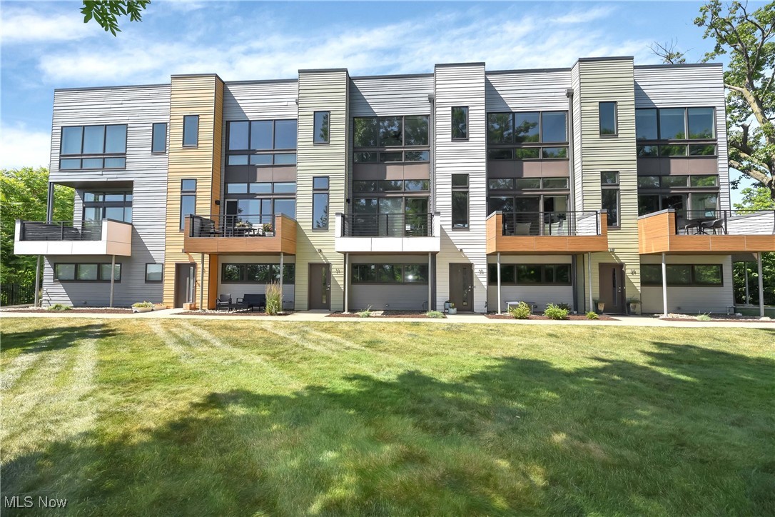 Simply spectacular townhome overlooking the Emerald Valley of Cleveland Metroparks, featuring high end European design and modern custom finishes throughout. Lower level two car garage, den, and foyer. Entering the second level from the open glass staircase, you will find the 10' living room, dining room, kitchen, and 1/2 bath. Third level primary bedroom and en-suite bathroom with glamorous oversized steam shower and soaking tub, and walk-in closet, second bedroom, full bath, and laundry. Fourth level has a gorgeous view and a rooftop kitchen absolutely perfect for summer entertaining! Bamboo flooring is offered throughout with exception of ceramic tile in the full bathrooms. The kitchen countertops are quartz with stainless steel appliances, while the living room is equipped with a wet bar, fireplace and walk out patio. Many floor-to-window ceilings and custom solar shades complete the entire package of low maintenance living. Walking distance to Cleveland Clinic Fairview Hospital, restaurants, shopping, and more!