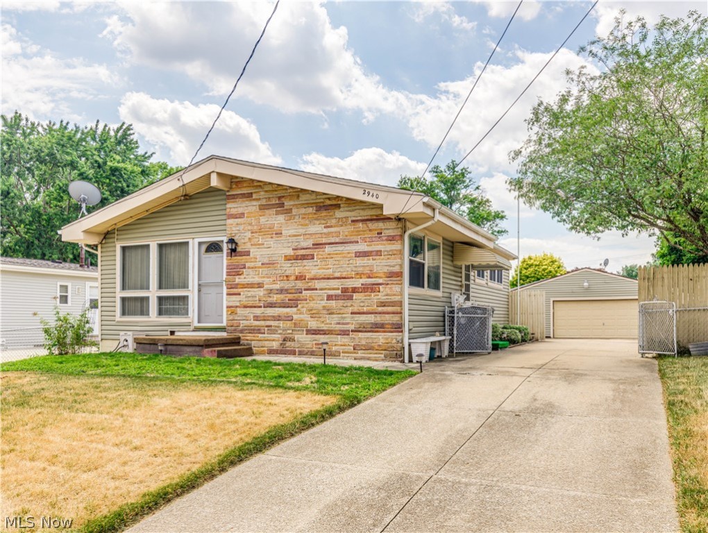 Lots to like in this charming Ranch. Centrally located with easy access to the highway, the first thing you become aware of when you pull up to 2940 Stockton St is the outstanding curb appeal.  Vinyl Siding with Stone Accents, a completely fenced yard, 2+ car garage, fantastic cement driveway and a completely fenced yard! Entering the home, you are greeted by vaulted ceilings and a large living room that is open to the kitchen. The 3 bedrooms all have wood flooring under the carpeting as does the living room.  The full bath boasts double sinks.  Need more room?  Wait until you see this basement.  A big Rec Room, possible 4th bedroom plus and extra room to use your imagination.  There is also a shower stall in the basement for your added convenience. Specific dates are not known, but siding and roof are approx. 10-12yrs, windows were updated but date not known, furnace and C/A are thought to be about midlife. Own this home for less than you would pay in rent!  Call for your private show