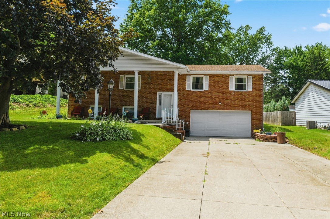 Welcome home to this inviting split-level in the Barberton City School District! Offering 3 bedrooms, 2.5 bathrooms, and a potential 4th bedroom on the lower level, this home provides a flexible layout for a variety of lifestyles.

The main level features a bright kitchen with quality Shrock cabinetry, ample storage, and comfortable living spaces for everyday living and entertaining. The lower level includes a cozy family room with a fireplace, a half bath, and a versatile bonus room perfect for a bedroom, office, playroom, or hobby space.

Enjoy the heated and cooled sunroom overlooking the fully fenced backyard with a spacious deck and storage shed. A large attached garage provides plenty of room for vehicles and extra storage.

Conveniently located near schools, parks, shopping, dining, and major routes, this home offers the space and functionality you've been looking for.