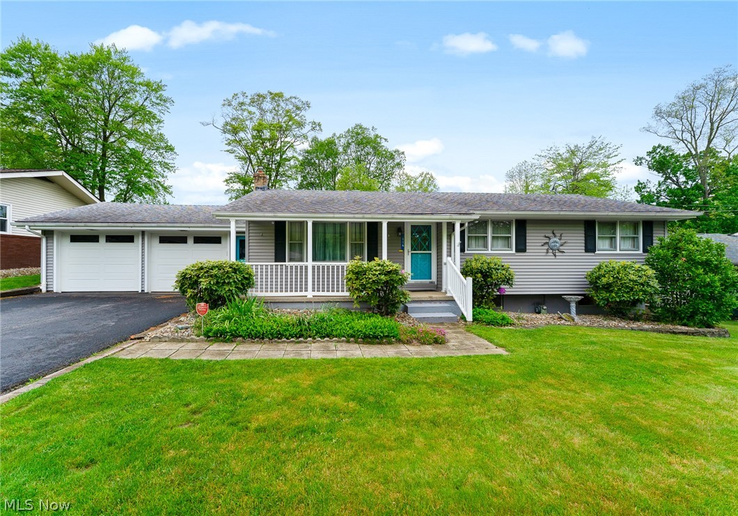 Charming ranch home in desirable New Middletown offering comfortable one-floor living with spacious additional living space in the basement. The inviting open eat-in kitchen flows seamlessly into the stunning family room featuring walls of glass windows that fill the space with natural light and provide beautiful backyard views. The main level also includes a welcoming living room, three bedrooms, a full bath, and a convenient pantry/laundry combination.
The finished basement expands the living area with a large rec room perfect for entertaining, hobbies, or recreation, along with a second full bath and ample storage space.
Exterior amenities include a two-car attached garage, a covered front porch, rear deck with pergola ideal for outdoor gatherings, beautifully landscaped rock garden, and a storage shed for additional convenience. A wonderful opportunity to enjoy both indoor comfort and outdoor relaxation in a peaceful setting.