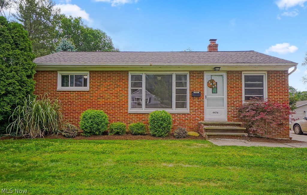 Nicely updated brick ranch on a quite street. Gorgeous hardwood floors throughout. Three bedrooms and a full bathroom on the main floor. Partially finished basement with a custom built in bar and updated half bath. Beautiful custom built pergola and stone patio out back. Many updates including newer roof, windows and hot water tank. Spacious 2 car garage. This is a solid home in a great neighborhood. Come see this wonderful property today!