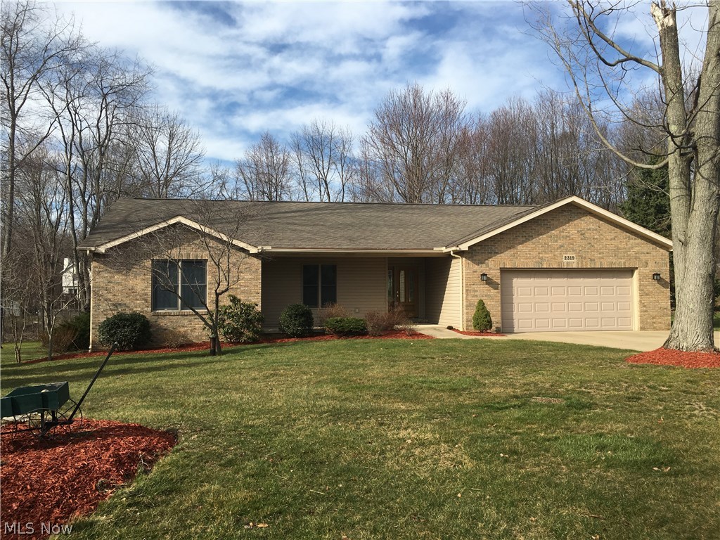 The beautiful home and location you've been waiting for simply has it all.  Built for a loved one, improved by a builder, enjoyable to own.  You'll appreciate the open floor plan (totally handicap, motorized wheelchair accessible) 1920 sq ft on main floor with inviting sunroom comfortably viewing all seasons.  Real hardwood floors in foyer, dining, kitchen, and laundry rooms.  First-floor master 15x15 with great organized closet and brand new double sink and vanity.  Nice-to-know features include ventless gas-start fireplace, 6 panel doors, vaulted ceiling, handy BBQ deck, 150 amp home electric panel, attic fan, central air, clothes dry (gas or electric), neutral décor, professionally landscaped.  More than ample kitchen cupboards and counter space with new stainless steel appliances.  More brand new items include 22 KW Generac backup system makes this home worry free, steel supports under sunroom, 3/4 hp 'quiet' motorized garage door opener, insulation, 3/4 hp well pump/large bladder