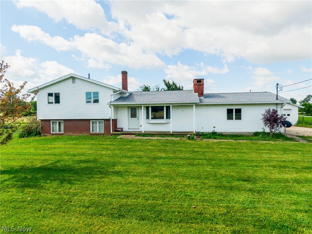 "Online Only Auction Ends July 22". Enjoy country living in this 4-bedroom, 1-bath split-level home situated on nearly an acre of land. This property offers plenty of space both inside and out, featuring a 24' x 26' detached garage, a large sunroom for relaxing or entertaining, and convenient main-level laundry. The kitchen was updated in 2003 and provides a functional layout with ample workspace. An outdoor wood burner offers supplemental heat to help keep heating costs in check during the colder months.
The bones are all here—move in and make updates at your own pace, or bring your vision and put your own twist on this home. With multiple living areas and a versatile split-level layout, you'll appreciate the flexibility and room to spread out. If you're looking for a peaceful country setting with nearly an acre of land and plenty of potential, this property is ready for its next chapter.