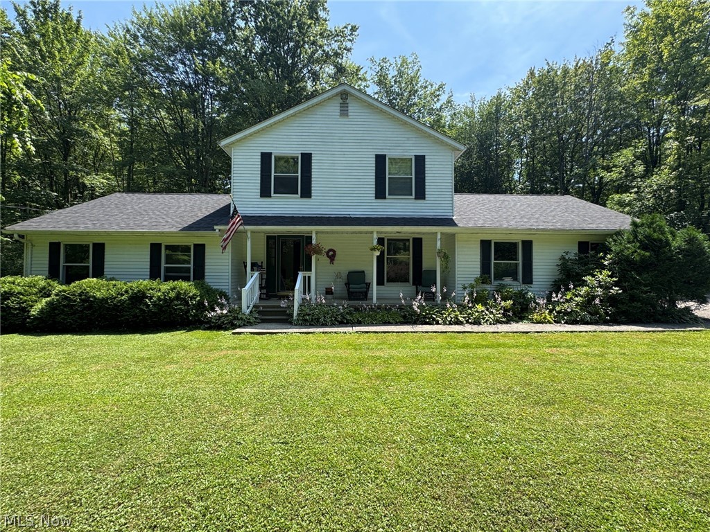 Nestled on 2.6 secluded wooded acres in Concord Township, this 4-bedroom, 2.5-bath Colonial offers privacy and a peaceful setting at the end of a long, winding driveway through the woods. A welcoming covered front porch leads into the spacious foyer and living areas. The main level (first floor) features a large living room, a comfortable family room with built-in bookcases and skylights, a spacious dining room that can easily serve as a first-floor home office, a convenient half bath, and a first-floor laundry room. The eat-in kitchen includes all appliances and opens to an expansive deck that spans the entire length of the home, providing the perfect place to relax, entertain, and/or enjoy the tranquil wooded surroundings. Upstairs, you'll find four generously sized bedrooms, including the primary bedroom with ensuite, along with an additional guest bath. The attached two-car garage provides convenient entry to the home and main living area. The partial basement offers excellent potential for additional finished living space, a recreation room, home gym, or abundant storage. Built with quality 2x6 construction, the home also features a newer roof and newer hot water tank. Outside, you'll appreciate the two storage sheds, including a spacious 20' x 12' shed that's perfect for storing lawn equipment, gardening tools, outdoor furniture, and seasonal items. The wooded setting offers exceptional privacy while still being just minutes from freeway access, shopping, dining, parks, and other everyday amenities. Enjoy the best of both worlds—a peaceful, secluded retreat with the convenience of nearby services and easy commuting. This well-maintained Concord Township home is ready for its next owner.