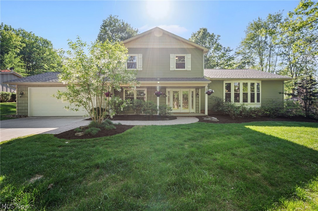Welcome to 8662 Tanglewood Trail in the sought-after lake and beach community of Tanglewood with award-winning Kenston Schools and Geauga County taxes. This beautifully updated 3 bedroom, 2.5 bath split-level home offers stunning views of the Tanglewood golf course fairway, and lake view. Refinished hardwood floors flow throughout the main living areas with new LVP in the mud room and living room. The open eat-in kitchen features granite counters and natural light. A cozy wood-burning fireplace anchors the family room. The first-floor office could serve as a fourth bedroom. Upstairs, the owner's suite features crown moldings and a private bath. The second-floor hall bathroom was fully remodeled in 2024 with a new tub, shower, vanity, tile work, and fixtures. The lower level offers a finished recreation room plus storage. Step outside to the brick patio and landscaped yard with a stunning water feature overlooking the golf course. Brand new roof & siding (2026). New AC, furnace, and hot water tank (2023). New commercial water softener (2023). Newer windows and sliding barn door from kitchen to living room (2023). Interior freshly painted (2026). The Tanglewood Lake Association offers an incredible array of amenities including pickleball courts, recreation, a golf course, and more! This is Tanglewood living at its finest!