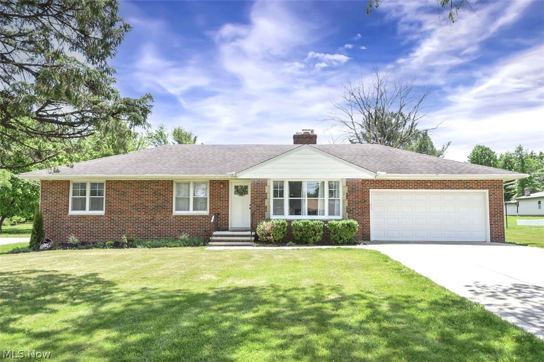 Welcome home to this beautifully maintained ranch offering three spacious bedrooms, two fully updated bathrooms, and exceptional curb appeal. The attractive brick front exterior creates a warm first impression, while the expansive 1.16-acre lot provides plenty of green space for outdoor activities, entertaining, gardening, or simply enjoying the peaceful surroundings. Step outside to the inviting back patio, the perfect place to enjoy your morning coffee or unwind while taking in evening sunsets. Inside, you’ll find luxury vinyl flooring throughout the main level, creating a seamless and modern look. The bright and inviting living room features a cozy wood-burning fireplace, charming wainscoting, and recessed lighting that adds warmth and character to the space. A formal dining room flows effortlessly into the eat-in kitchen, making entertaining a breeze. The gorgeously remodeled kitchen is sure to impress with its white shaker cabinetry, quartz countertops, newer appliances, recessed lighting, and abundant workspace. The three generously sized bedrooms offer excellent natural light, ample closet space, and comfortable living accommodations. A beautifully remodeled full bathroom completes the main level. The fully finished lower level expands your living space with a cozy family room centered around a second wood-burning fireplace. You’ll also find a bright and clean laundry room with a modern finish, a well-lit workout room, and a second fully updated full bathroom. This move-in-ready home combines comfort, style, and functionality, all in a beautiful setting you’ll love coming home to.