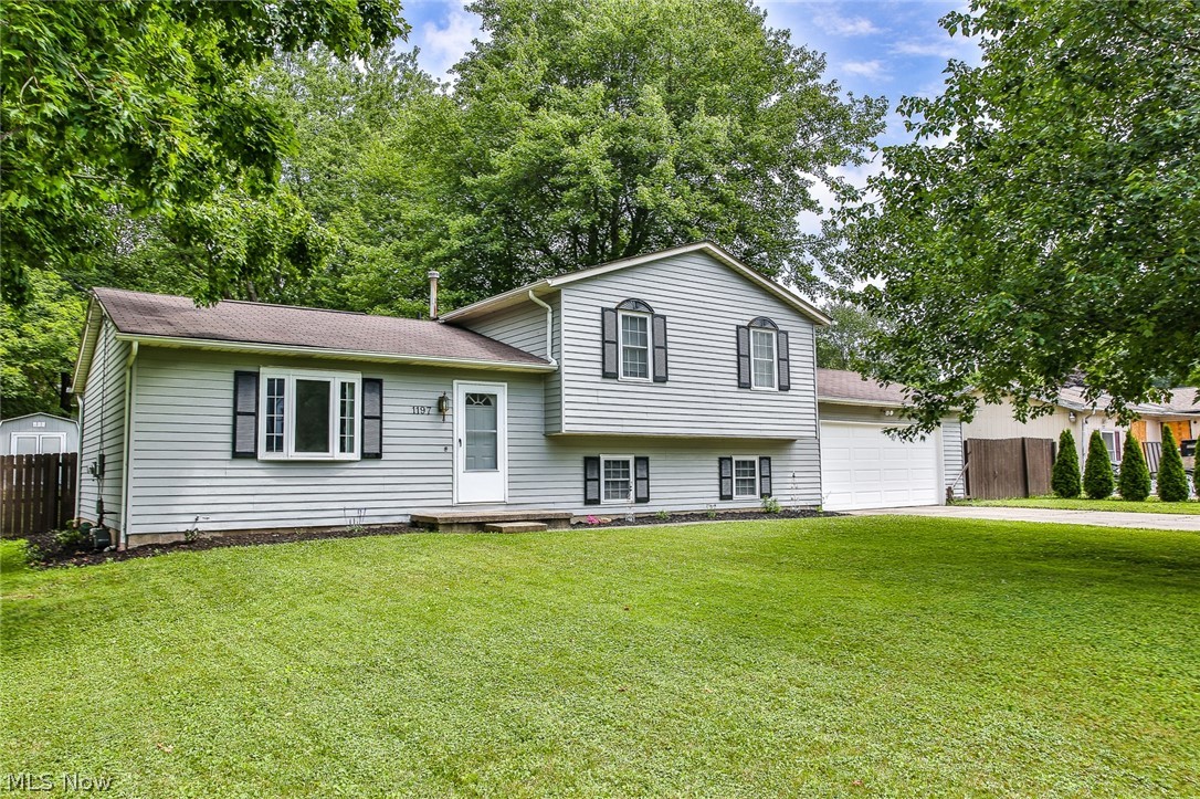 Sparkling four level split home with updates everywhere! All windows are vinyl replacement. New carpeting throughout in 2015, all new interior paint in 2016 in fashion colors. Kitchen opened up and updated with Granite Counter tops Subway ceramic tile. Three new ceiling fans. Central Air replaced in July of 2019 with quality Trane unit. A re-purposed storage shed was added in back yard in 2016. Exterior was completely repainted in 2019. New Gutters in 2016. There is an optional association fee for use of community lake (Brimfield Lake) $100 annually... Sellers have never used. Quick access to Kent State  and I  & I-76. Home warranty offered by Seller.