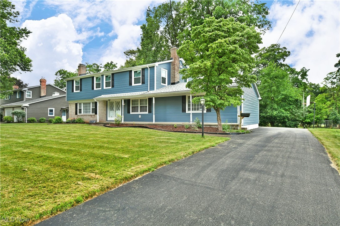This classic colonial is loaded with major updates, including new installed Central Air, and is sure to impress! Welcome to 179 Southwoods Ave in Boardman! This nearly 2,800 square foot home packs a punch with 4-5 bedrooms, 4 baths and plenty of living space. Take note of the charming curb appeal as you approach the home. Inside a light filled living room showcases original hardwood flooring and a beautiful fireplace. Adjacent is the dining room complete with built-in hutch storage and french doors that lead to the sunroom. The large kitchen is steps away and is outfitted with tons of counter space, wood cabinetry, and updated appliances! Just beyond the kitchen is a convenient first floor laundry area, half bath, garage access, and a perfect guest room or home office! The wood lined family room is just across the hall providing a moody backdrop for a second fireplace. Upstairs, the oversized primary suite has a large walk-in closet, updated carpeting, and a full bath. 3 more large bedrooms feature ample closet space and original hardwood flooring and join a tandem full bath and powder room to complete this level. The lower level present so much opportunity for furtue expansion! Hangout space? Home Gym? Dream away! There is even plumbing in place for an additional bathroom! The basement houses mechanicals, storage space, and walk up access to the attached garage. What are you waiting for? Call today for your personal tour!  **Updates: Central Air 2025, Roof 2020, Gutters 2021, Soffits 2021, Siding 2021, Windows 2021, Electric Panel 2024, Kitchen appliances 2024, Garage opener 2024, Sump Pump 2024, Driveway replaced 2021 and sealed 2024, Boiler Circulation Pump 2016, HWT 2025.