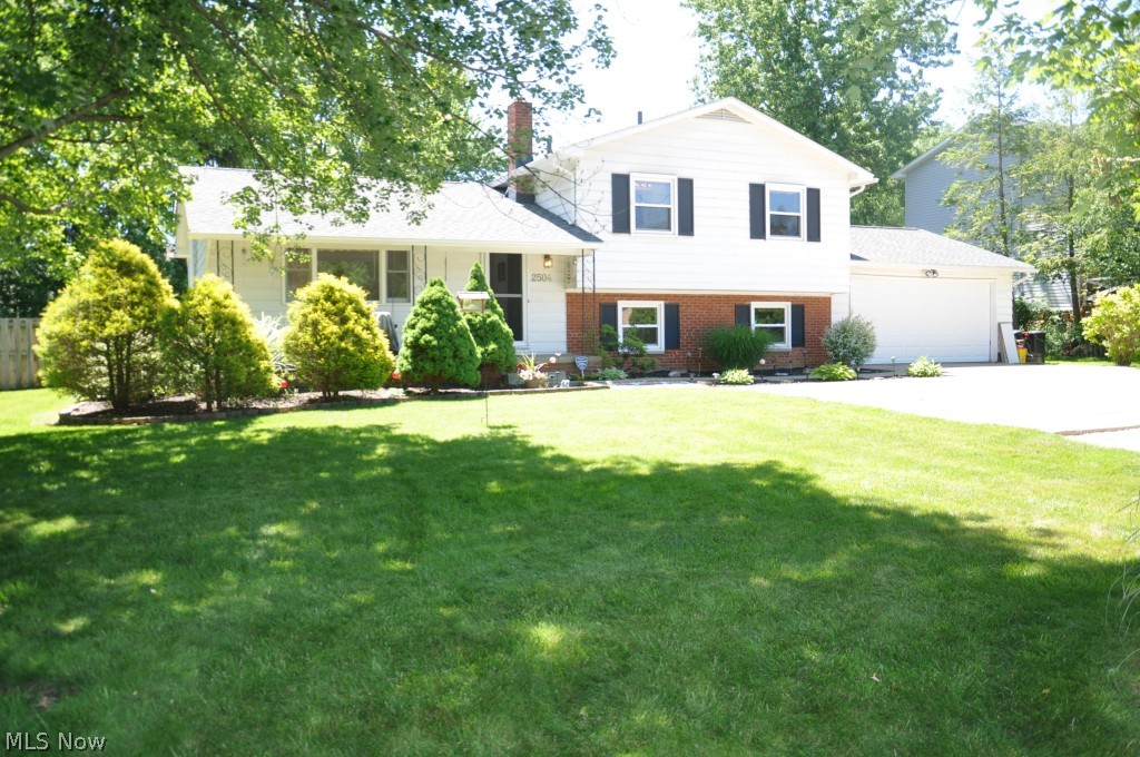 4 bedroom, 2.5 bath home with updated kitchen & baths. Beautiful hardwood floors in living room w/gas fireplace and dining room with slider that leads to new deck overlooking large, fenced in backyard. New counter tops, cabinets, appliances, and floor in kitchen. Master bedroom with new master bath. Spacious family room with walkout to backyard. Many improvements including new roof (2012), central air (2009), new hot water tank (2014), garage door (2014), fresh interior paint and light fixtures. Convenient location and Revere Schools.