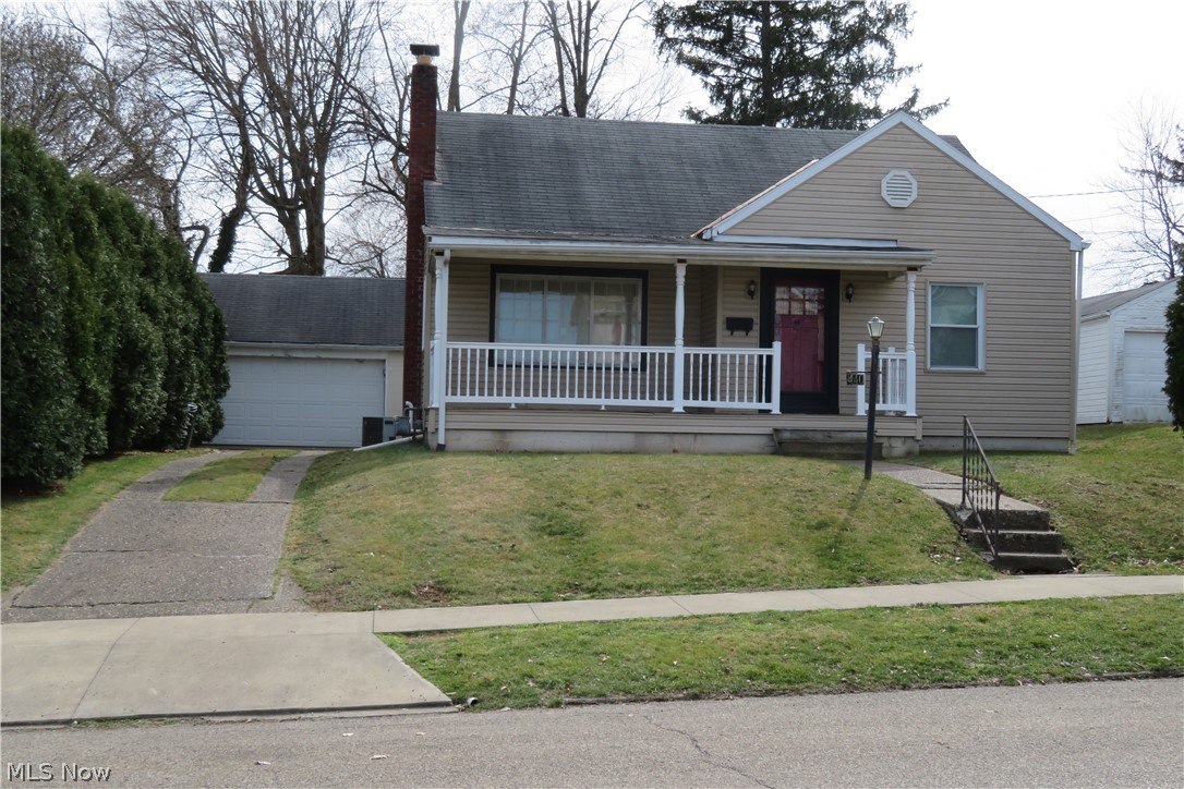 This 1.5 story house has newer windows and vinyl siding with a front porch for relaxing. There is a two-car garage, a back patio with a ceiling fan, and a private, fenced back yard. Inside you are surprised to find so much living space. Hardwood floors throughout, an ornamental gas fireplace  and built in shelving on one wall of the dining room. Main bedroom is on the first floor and 2 bedrooms are upstairs with a half bath. The lower level has a bar and a shower. Refrigerator, range, dishwasher, dryer, washer, and freezer stay. They are believed to work but not warranted. With a little work this house could be brought to its former luster. Property is being sold in its present condition. Cash or conventional financing only.