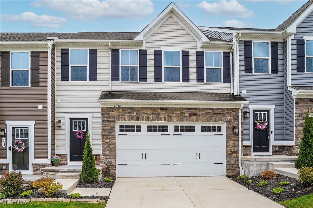 Here's an opportunity to live in the beautiful new upscale Stow community (just off of Darrow Road at the border of Stow and Hudson) named "Towns of Cedar Crest" This townhome was just built in 2021 and it is still in impeccable condition. The open floor plan is designed to be filled with natural light throughout. The color scheme is light and bright with soft neutral tones in every room. The spacious Great Room is open to the kitchen and dining area. The kitchen has 42 inch upgraded cabinets, stainless appliances, a large island with breakfast bar and beautiful quartz counters. The sliding doors from the dining area lead to the backyard with a nice green lawn space overlooking an attractive landscaped mound that borders the community. Finishing out the first floor is a 1/2 bathroom, access to the garage and an unfinished basement offering wide open spaces to utilize. The second floor has three spacious bedrooms, double closets in the master bedroom, 2 full bathrooms and a loft area for work or play. Take advantage of this opportunity to enjoy carefree living where the exterior maintenance is included with townhome living!