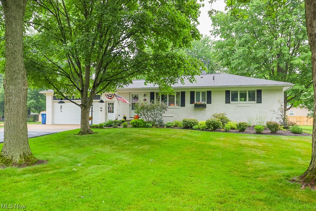 Don't miss this 3 bedroom, 2 FULL bath ranch in Macedonia. This beautiful home features a large family room with a wood burning fireplace, a spacious eat-in kitchen, and 3 nicely sized bedrooms. There is plenty of storage in this home with a full basement, 2 car heated attached garage, and 10 x 14  shed with electrical!  You'll enjoy this large back yard and beautiful landscaping from the enclosed patio and porch. Move right in and enjoy the various updated and superb upkeep and care that has been put into this home. New roof 2021, Kitchen counter tops refinished 2020, 1st floor bathroom new tub & shower 2023, Basement new linoleum 2017, Basement bathroom remodel 2016, Main electrical panel upgraded 1999, Garage electrical panel upgraded 2021, Garage floor replaced 2007, Garage heater replaced 2022.