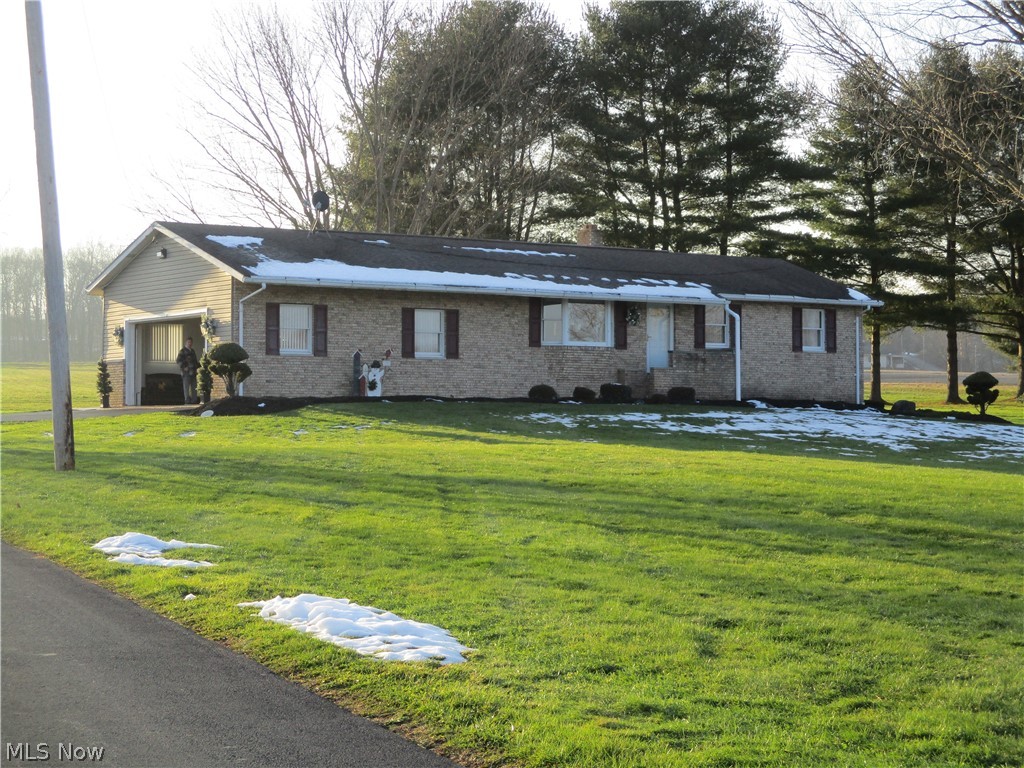 Absolutely beautiful ranch that is move-in ready. Just a few miles outside of Greenville Borough, in West Salem Township.  This 6 acre property is meticulously
maintained and extras galore.  Attached two-car garage is beautiful with storage galore.  The best part of the garage is the "Nature Stone" flooring that extends outside for the apron and sidewalks. The covered patio is off the eat-in kitchen for easy access for entertaining.  This area is complete with wind/snow protection. 
Basement floor is heated and the size of the family room allows for lots of guests.  Full bath with tub/shower and amazing laundry area in this wonderful basement.  More storage for anything seasonal or occasional usage.  There is a sump pump with battery back-up. Every detail has been taken care of with a great amount of care and quality throughout.