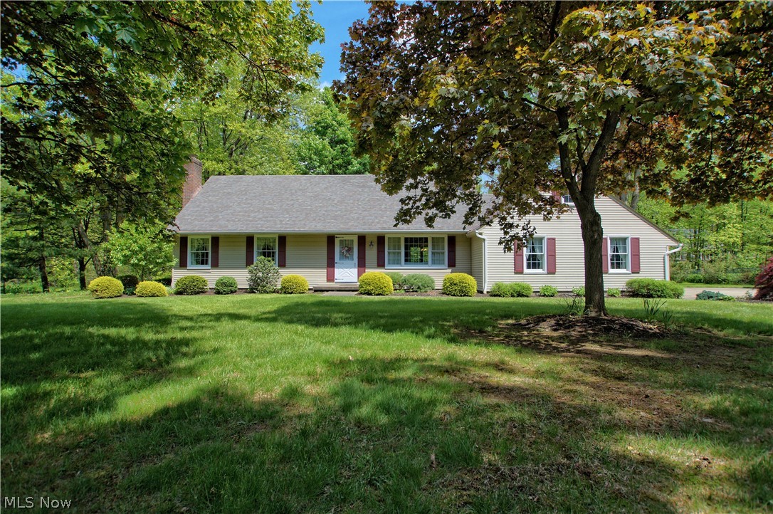 Meticulously maintained cape cod home located in a wonderful neighborhood in Hudson. First floor master with lighted ceiling fan and updated bath with tiled shower. Living room is carpeted with wood floor underneath. Gas fireplace and built-in cabinets perfect for entertaining. Formal dining room and eat-in kitchen have hardwood floors. Birch Schrock cabinets with pull outs, pantry and dining area that looks out to the private wooded backyard. The cozy family room has a wood burning fireplace and built-ins surround the brick. Two more large bedrooms upstairs that share the hall bath with tub/ shower  and has shelves, built-ins and hardwood floors. Sun room off the dining room is a great place to relax with your morning coffee and enjoy the weather. The lower level is partially finished with nature stone. The laundry room is shared with the storage area, furnace/ AC. 1 year home warranty included. Roof 1998 with 30 year shingles, Anderson windows 1998 except kitchen and master bath 1986