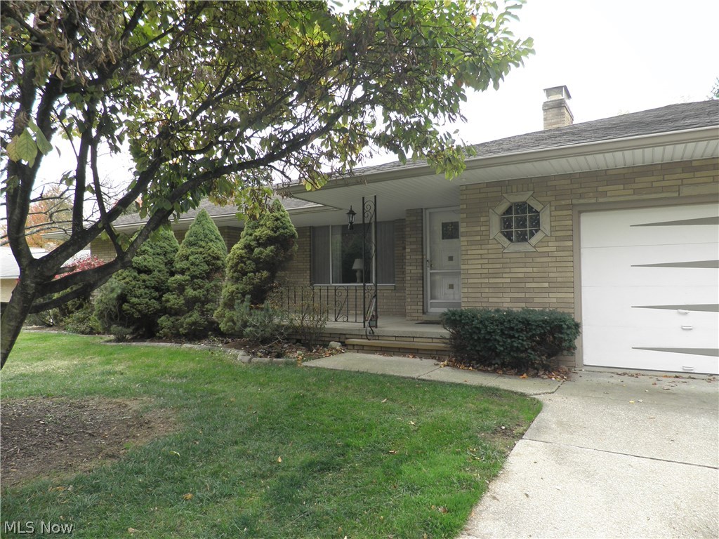 BACK ON MARKET. Spacious solid brick ranch! This meticulous home has been lovingly maintained and nicely updated. The inviting front porch welcomes you home. Enter into a large living room with picture window and wood burning fireplace. The living room flows into the dining room. The spacious kitchen features lots of cabinets, built in appliances, and newer flooring. The kitchen opens to the family room with sliding doors to the covered back porch. Gorgeous hardwood floors flow throughout the living room, dining room, hallway and bedrooms. The spacious master bedroom has ample closet space and a private updated bathroom with shower. A walk in cedar closet is located in the hallway by the master bedroom. There are two more spacious bedrooms and a completely updated main bathroom. The lower level features an enormous recreation room with a second wood burning fireplace and newer carpeting. The other half of the basement offers storage, a workroom with tons of built in cabinets, a laundry