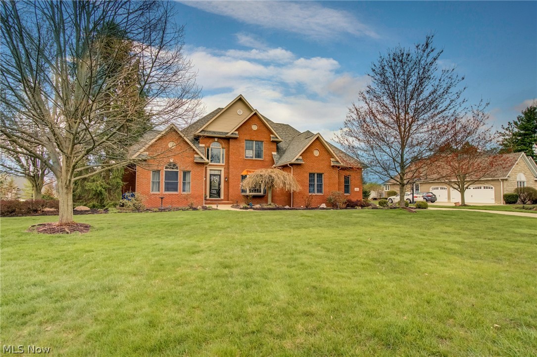Welcome to this beautiful, custom all brick Colonial in Fox Meadow with first floor master and totally renovated master bath with walk in closet. Hardwood floors and two-story great room with wall of windows and floor to ceiling stone fireplace and wood burner. Updated kitchen with large quartz island and stainless steel appliances. Enjoy your coffee and breakfast in the morning/sun room that leads out to your private deck. Your plants will love this space. too!   
Second floor living space has three bedrooms with updated Jack and Jill bath and third bedroom en-suite bath. All bedrooms have private walk-in closets! Lower level is designed to relax and have fun, too!. Solid wood doors to include room with gorgeous additional fireplace and French doors and space for a home office or an in-law or teen suite. Also includes large kitchenette area that could be converted to a bar or craft room, if desired. Tons of storage behind the finished space and possible workout room or workshop! Base