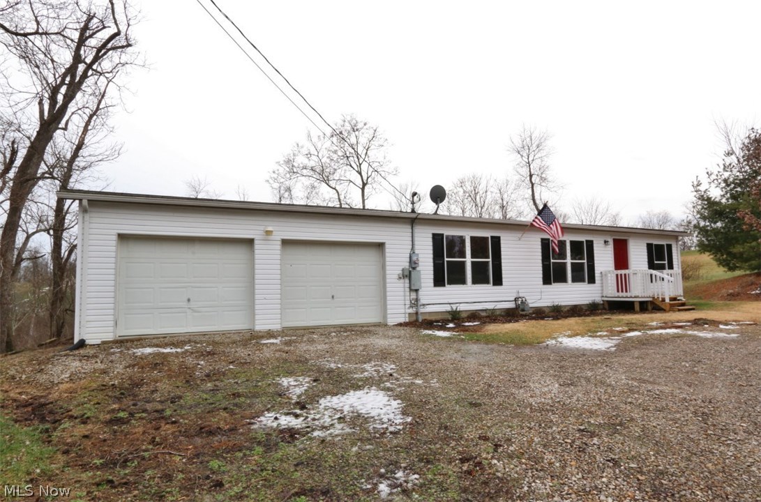 Great 3 bedroom, 2 bath manufactured home on a permanent foundation with an attached 2 car garage and big back yard.  Master bedroom with walk in closet, master bath features garden tub with seperate shower.  All new floor coverings and paint.  Property being sold "as is"