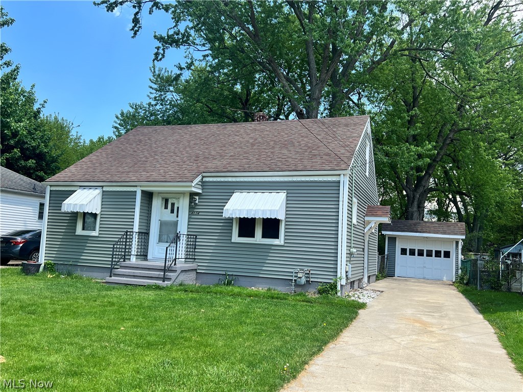 Move right into this adorable cape cod home sitting on almost a quarter acre! Updates in the past 11 years: Newer roof and gutters, vinyl siding, windows, concrete drive, furnace, carpet, paint, some lighting fixtures, kitchen countertop, shower/tub combo, commode and luxury vinyl flooring. 2 bedrooms on the main floor with a walk-up attic that could be finished for a large third bedroom. Hardwood floors under the new carpeting on the first floor. Outside there is a one car detached garage and a partially fenced in backyard. All sitting on .23 acre! Nothing to do but move in! Listing agent is related to the owner.