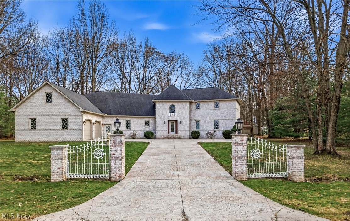 This stunning one-owner European-style home, built by John Brothers and Robert Yuhanick, is located in a highly desirable area and offers exceptional space, craftsmanship, and comfort. A dramatic two-story foyer with a graceful curved staircase welcomes you inside, where cathedral ceilings, pristine hard wood flooring and an open floor plan create a bright and impressive living space. The expansive kitchen is ideal for everyday living and entertaining, featuring abundant cabinetry, extensive counter space, a large walk-in pantry, and a striking 9-foot island. Elegant custom crown molding adds sophistication throughout the home. With four bedrooms, the home includes both a main-floor and second-floor primary suite, each offering a full bath and generous closets. One additional bedroom is beautifully enhanced by two skylights that fill the space with natural light, while the fourth bedroom is also spacious and filled with abundant light. Relax in the sun-filled, window-lined sunroom that opens to a lovely deck for seasonal enjoyment, or gather in the inviting living area highlighted by a fireplace. Additional conveniences include first-floor laundry, three full baths, and an attached 2+ car garage with massive finished storage space above, making this exceptional home both elegant and highly functional.