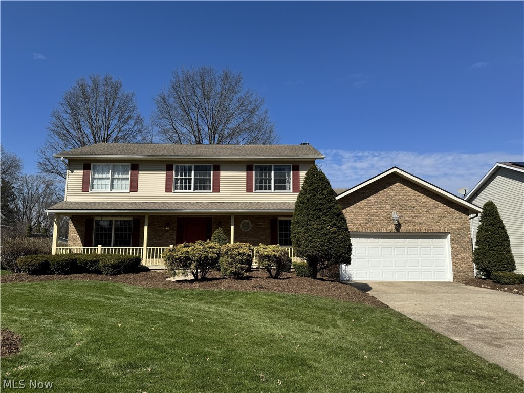 Welcome Home to 733 Austin Drive! This meticulously maintained 4-bedroom, 3-bathroom Colonial offers the perfect blend of classic charm and modern comfort. Nestled on a spacious 0.33-acre lot, the property greets you with beautiful stone accents and a welcoming curb appeal. Inside, enjoy an open floor plan featuring a cozy fireplace for chilly evenings and central cooling for the summer months. It also features a beautiful four-season room with walk-out access to the back porch! The generous bedroom sizes and finished living space make it ideal for growing or entertaining. Step outside to your private backyard, perfect for weekend BBQs or a quiet morning coffee. Don't miss your chance to own this Barberton gem!