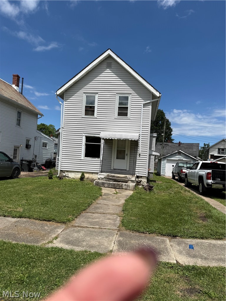 This property is in re-hab stage.  If you're looking for a fixer upper, this is it.  It has 2 bedrooms and full bath up with laundry room upstairs for convenience.  There is a large living room and kitchen plus 1/2 bath on the main floor.  It features a full basement and one car garage.  Priced to sell.  Just bring a saw and hammer.  
Bring an offer.