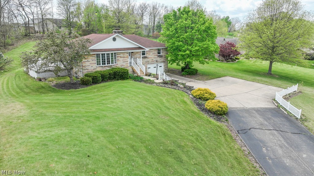 Welcome to this inviting 3-bedroom, 2.5-bath ranch set on 1.525 acres in town—offering a rare blend of space, privacy, and everyday convenience with city utilities.

From the moment you step inside, you’ll appreciate the comfortable layout and warm, welcoming feel. The spacious living room is anchored by a cozy fireplace, creating the perfect setting for relaxing evenings or gathering with family and friends. 

The main living areas showcase durable waterproof vinyl plank flooring through the living, dining, and hallway spaces, complemented by refreshed trim, updated outlets, switches, and lighting fixtures that give the home a clean, updated feel. Bathrooms have been improved with updated toilets and refreshed shower valves and drains. The lower level offers additional entertaining space with a bar area and a private half bath.   Additional improvements include updated central air and hot water tank, along with replacement of most windows and doors.

Step outside and enjoy your own private retreat. The 14x24 vinyl deck offers the ideal space for entertaining, morning coffee, or unwinding at the end of the day—all while overlooking a peaceful backyard with room to spread out and enjoy.

Properties like this don’t come along often—offering the feel of country living with the convenience of an in-town location. A must-see to truly appreciate all it has to offer.