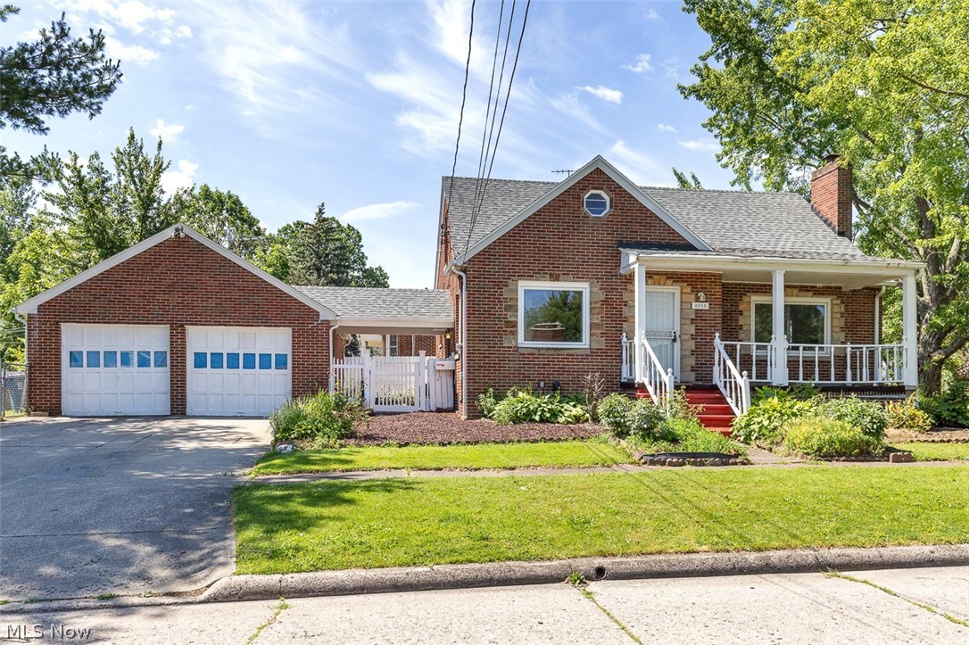 Welcome home to this charming brick Cape Cod that offers timeless character and plenty of space to enjoy. Relax on the covered front porch before stepping inside to a cozy living room highlighted by a beautiful fireplace, natural lighting and original hardwood floors. The well designed kitchen features an abundance of cabinet space and a convenient breakfast bar, making meal preparation and entertaining a breeze. With three bedrooms and two bathrooms, this home provides comfortable living for a variety of lifestyles. A first floor bedroom offers added flexibility and convenience, while the second floor bedrooms feature spacious walk-in closets. The full basement provides excellent storage and additional possibilities for future use. Enjoy year round comfort with central air conditioning and the added efficiency of both gas and wood-burning furnaces. Outside, you’ll find a detached two car garage and a large fenced yard complete with a garden area and a strong landscaping foundation ready for your personal touch. A solid roof adds peace of mind, and the included one-year home warranty provides extra confidence for the new owner. Don’t miss the opportunity to make this well-maintained property your next home!