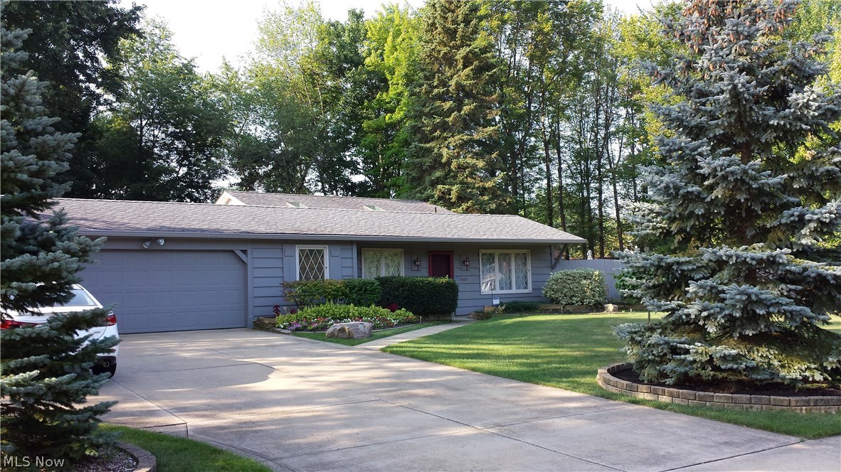 This beautiful one owner Strongsville reverse split level home is a must see. The home is situated on approx. 2/3 acre treed lot with a fenced back yard. The front door welcomes you into the spacious first floor formal dining and living room that leads to a custom patio with sun setter awning. This home has 3 bedrooms with Pella slim shade windows also a office or 4th bedroom. The Updated Kitchen has granite counters tops, tile flooring and all appliances are included. This home features 3 full baths.  2 gas fireplaces ( one in living room and one in the family room). The sun room has 2 large sky lights, wall of windows and a slider that opens to the patio and full view of back yard. The large 2 car garage has plenty of storage with an additional 14x10 Amish barn in the back yard. Added features include a security system, and 13x8 climate controlled greenhouse attached to garage and a private hot tub on the deck. This well maintained home is just 5 min from metropark and 15 min from ai