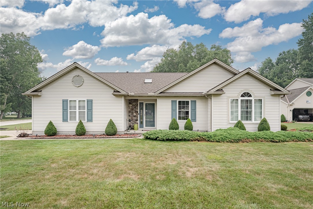 Welcome to this inviting ranch in the desirable Heatherstone Village community, where effortless single-floor living, vaulted ceilings, and sun-filled living spaces create a home that's both comfortable and functional. Thoughtful updates and an open floor plan make this move-in-ready home an exceptional opportunity.

A welcoming foyer greets you with a skylight that fills the space with natural light. The foyer opens to a spacious living and dining area featuring a soaring vaulted ceiling and newer LVP flooring. The well-appointed kitchen offers stainless steel appliances, ample cabinetry, a second skylight, and a charming bay window that creates the perfect eat-in dining area.

Privately situated off the living room, the primary suite offers a spacious bedroom with a vaulted ceiling, sliding door access to the backyard patio, a walk-in closet, and a private ensuite bath with dual vanities and a tiled shower surround. Two additional bedrooms and a second full bath provide comfortable accommodations for family, guests, or a home office.

At the rear of the home, a bright and airy sunroom extends the living space and overlooks the backyard. It is the perfect place to enjoy your morning coffee or unwind at the end of the day. A convenient laundry and utility room complete the interior.

Outside, the generous backyard features a spacious patio and storage shed, providing plenty of room for entertaining, gardening, or simply enjoying the outdoors. An attached two-car garage adds everyday convenience. Combining an open layout, thoughtful updates, and a desirable Heatherstone Village location, this exceptional home is ready to welcome its next owner.