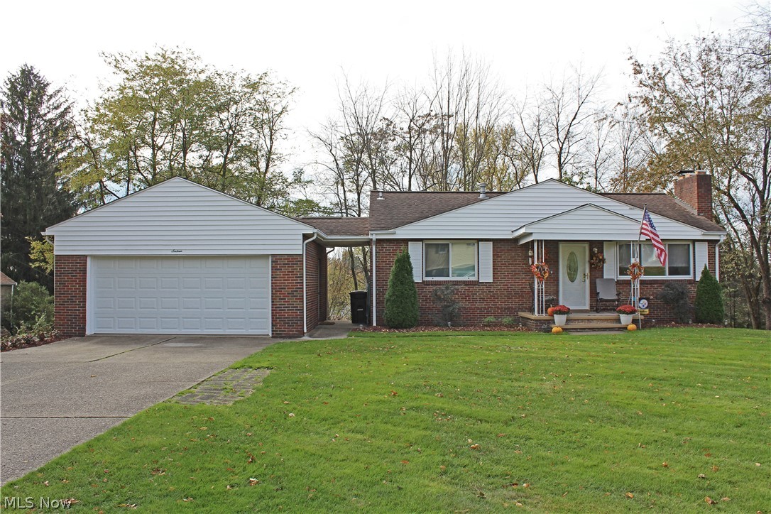 This adorable 3 bedroom, 2 bathroom brick ranch is a perfect fit for you! So convenient to everything located on Weirton Heights this peach of a find has beautiful hardwood floors, an updated, equipped kitchen, spacious rec room with gas log fireplace, tons of storage. The attached 2 car garage, double lot with a great yard and home warranty make this a great buy at $129,900!