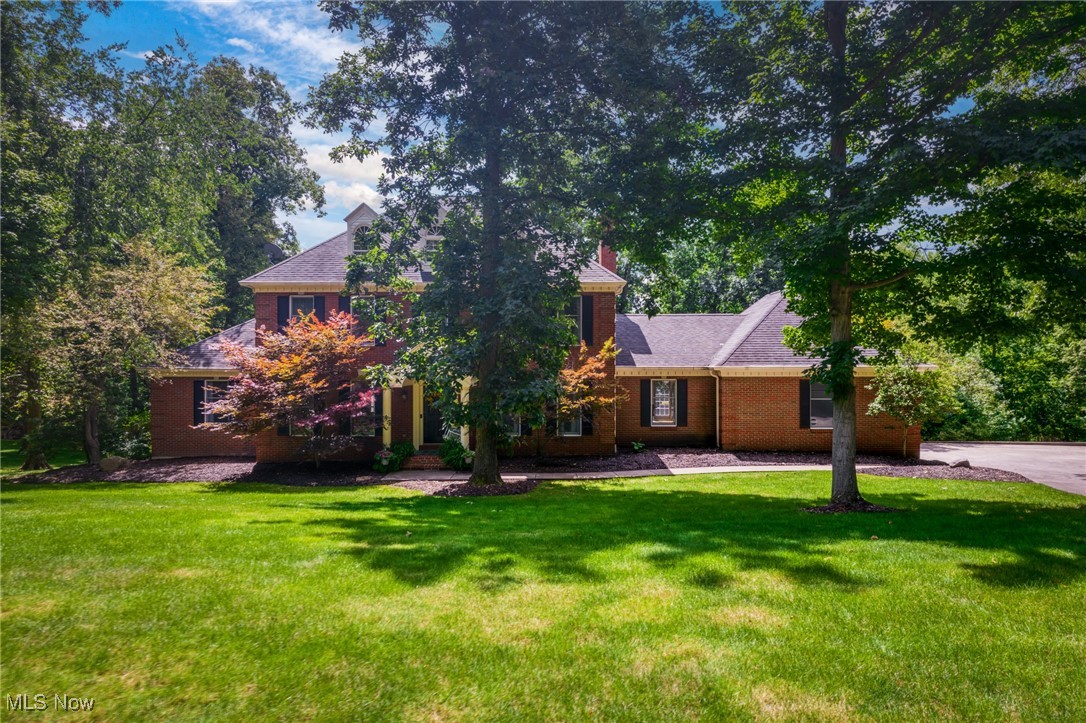 This fully updated, brick front custom build is the one you've been waiting for! Arched doorways, custom millwork and hardwood floors provide character while all the updates and fine finishes match everyday comfort. Boasting five bedrooms, three full and two half baths. This classic floor plan includes a private paneled office overlooking the private rear yard with entrance to the first floor primary suite beyond. Upstairs, four additional bedrooms all with jack & jill bathroom access. Expansive walkout lower level provides same level of fit and finish with half bath, gym and wine room.