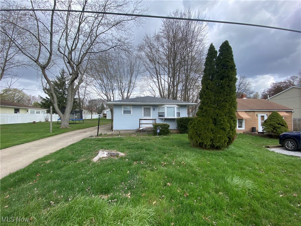 219 Hermann St in Barberton has been used as a rental for the past several years, renting at $1250/month, is a nice 1 story ranch with a spacious backyard. An empty lot is just beside it which creates a spacious feel between the houses however it is owned by the neighbor. An oversized detached garage will allow you to pull your car in on those snow filled days. As a bonus on the side of the garage there is a covered patio area to entertain or watch the family in the yard & a refrigerator in the garage will stay. On the main level entering from the side you'll see a long kitchen which has enough room for a table, refrigerator & stove stay. The cabinets have plenty of storage throughout. As a bonus there is an extruding bump out window for growing your favorite plants through the clear window glass. Off the kitchen there is a large family room that has a bay window that allows for plenty of light to come through. Down the long hall there are three bedrooms all of which are above average in size.  The house contains central air & a full basement. In the basement there are several rooms that could be used different ways. A washer & dryer on premise will be included & it appears there is a new water tank as well. The basement also has a sump pump with waterproofing around the inside. Extra support has also been added on several of the walls to stop bowing. This house doesn't have to be an investment property & would be great for owner occupied but looking for cash or possible conventional buyer. It's on a very nice street with well-kept homes. This is part of an estate where 6 other homes are listed in the portfolio and can be seen in the supplements. The estate executor does not know anything about the home & realtor is going by visual findings. As another bonus for park lovers or those with pets, there is a park 2 blocks away. This is an Estate sale & as such is being sold as-is where is with no seller financing, Inspections will be for informational purposes only.
