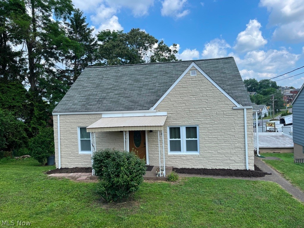Completely remodeled and move-in ready, this charming 3-bedroom, 1.5-bath Cape Cod home offers modern updates with timeless appeal. The main level features a fully equipped eat-in kitchen with brand-new cabinetry, countertops, and appliances, a welcoming entry, spacious living room with a decorative fireplace, two comfortable bedrooms, and a beautifully remodeled full bath. The upper level offers a generously sized third bedroom, while the lower level includes a convenient laundry area, half bath, and abundant storage space.  Extensive improvements include new carpet and laminate flooring throughout, fresh interior and exterior paint, new vinyl replacement windows, exterior doors, updated plumbing and fixtures, new lighting, pressure regulator, added insulation, and a completely renovated kitchen and main bath.