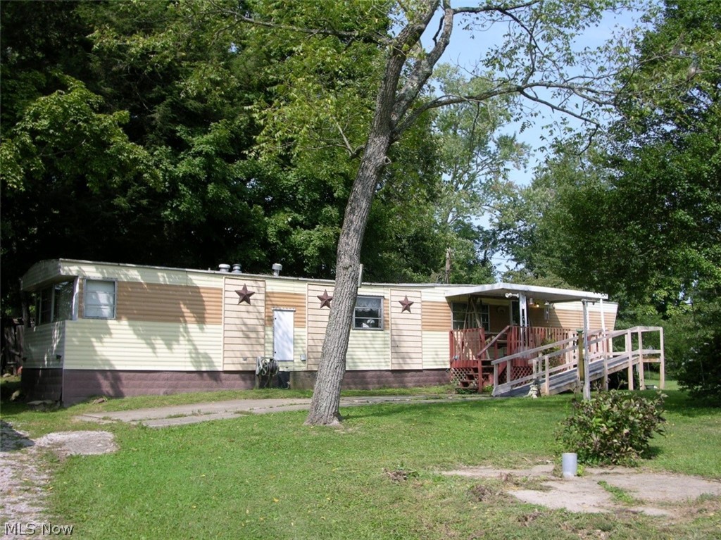 Awesome 2.56 acre parcel that could easily be developed into 4 home sites or if you desire a bigger site keep it as one large site and live in the 1980 Windsor mobile home while you build your dream home.  This property has so many possibilities - call today for more details and to view.