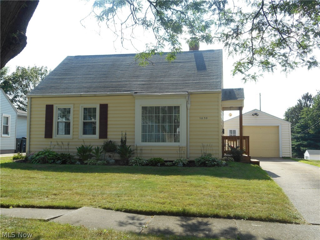 Super cute and clean!  Winning the 2017 Beautification Watch Award from the City of Akron, this home is warm and cozy.  The expansive, eat-in applianced kitchen offers plenty of cabinet and counter space and has an area for a coffee station!  The family room/all season sunroom is conveniently located off the kitchen with access to the extra-large backyard that is nicely landscaped.  The partially finished basement has been professionally waterproofed and provides additional living space that is functional and comfortable.  Updates include:  Many windows throughout, plumbing, stove, sink, kitchen flooring, furnace and hot water tank - all since 2014.