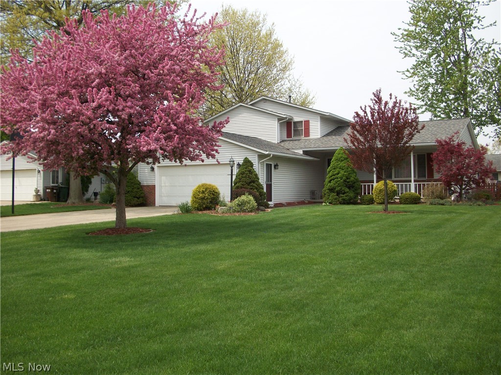 Very well maintained four bedroom, two full baths, original owner Split Level. Large family room with wood burning fireplace. Kitchen has dark oak cabinets, bar and enjoys a large eat-in area for family entertaining. Roof in 2011 with 50 year shingles. Hot water tank in 2012. Gas connection in laundry room. Security System built in by ADT. Garage is insulated and has 220V electric and hot and cold water, gas connection and pull down stairs to storage above garage. Cooling fans in attic. Welcoming front porch for those warm summer evenings. Fenced in back yard that has a 16x16 concrete patio and a 12x16 storage shed with 2nd floor loft, 220V electric and a 6x8 attached lean-to. Downspouts are drained to a underground basin in the North west corner of the back yard. Meticulously kept front and back yard landscaping with unique concrete edging around gardens and trees.